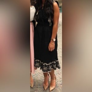 Black and white midi length dress with embroidered detailing. Size XS